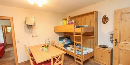Urlaub auf dem Bauernhof - Art der Unterkunft: Gasthaus - Österreich - Essbereich und Kinder-betten im Appartment - MILLINGHOF
