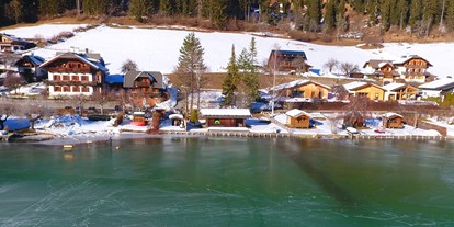 Urlaub auf dem Bauernhof - Weissensee - Winter und Spiegeleis vor der Haustüre - Ferienhof Obergasser & Pension Bergblick