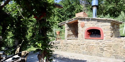 Urlaub auf dem Bauernhof - Streichelzoo - Italien - Blick auf unseren Pizzaofen und Grill - Agriturismo Casa Bivignano - Toskana